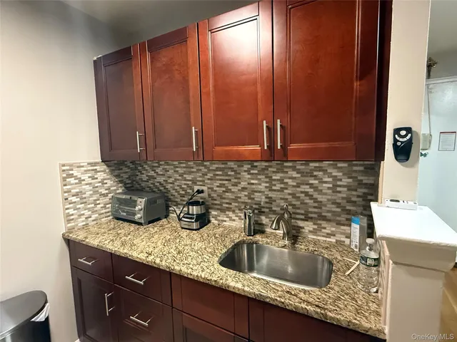 a kitchen with a sink and cabinets