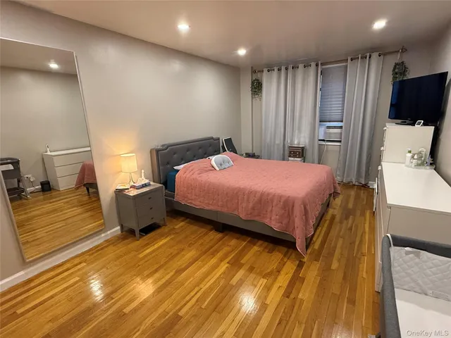 a bedroom with a bed and a view of bathroom