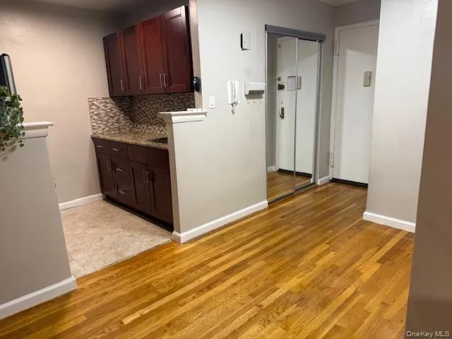 a view of a kitchen with wooden floor