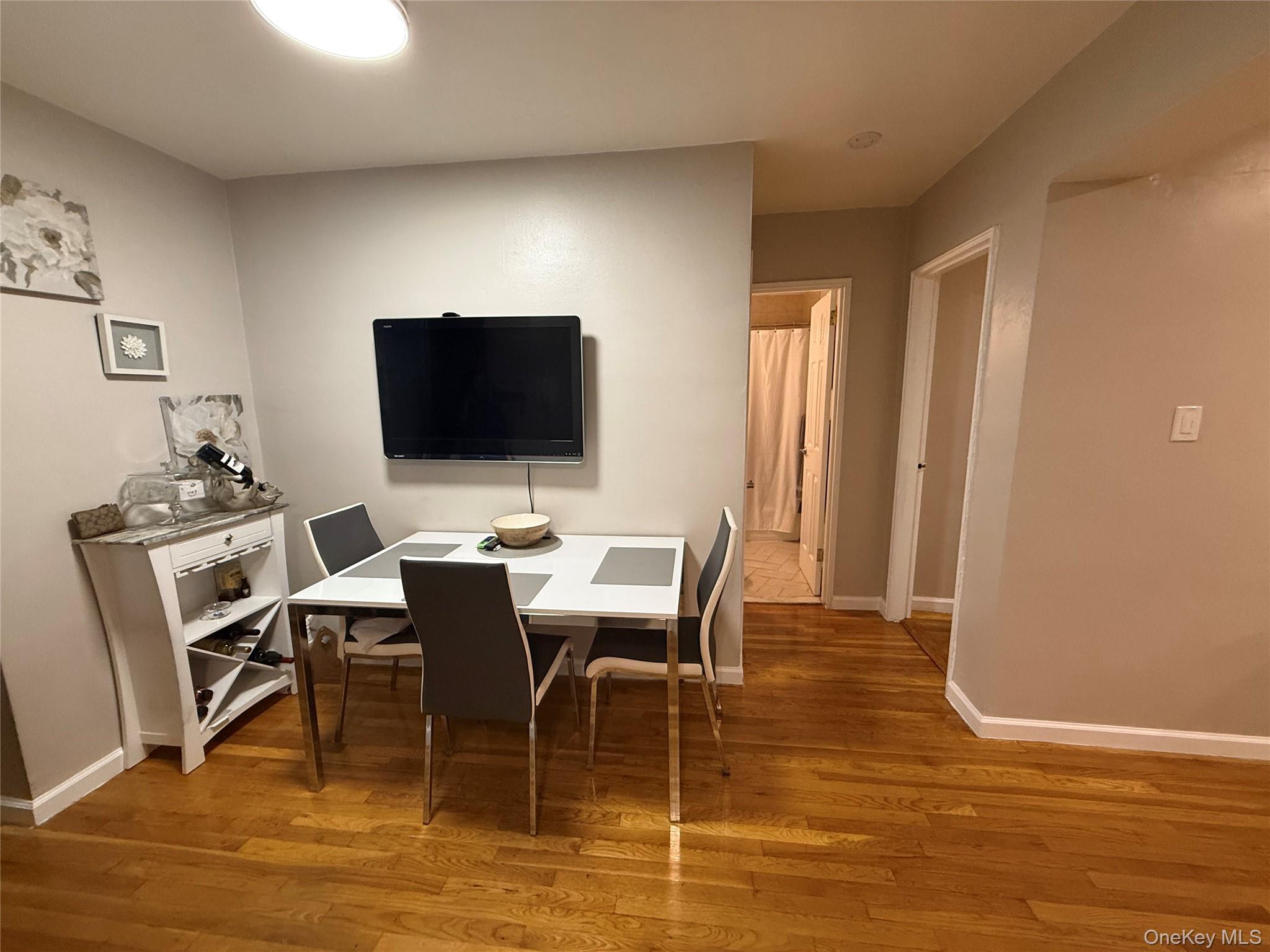 3123 Bailey Avenue, Unit 3A Bronx, NY 10463 - Photo 6 of 17 a view of a dining room with furniture and wooden floor