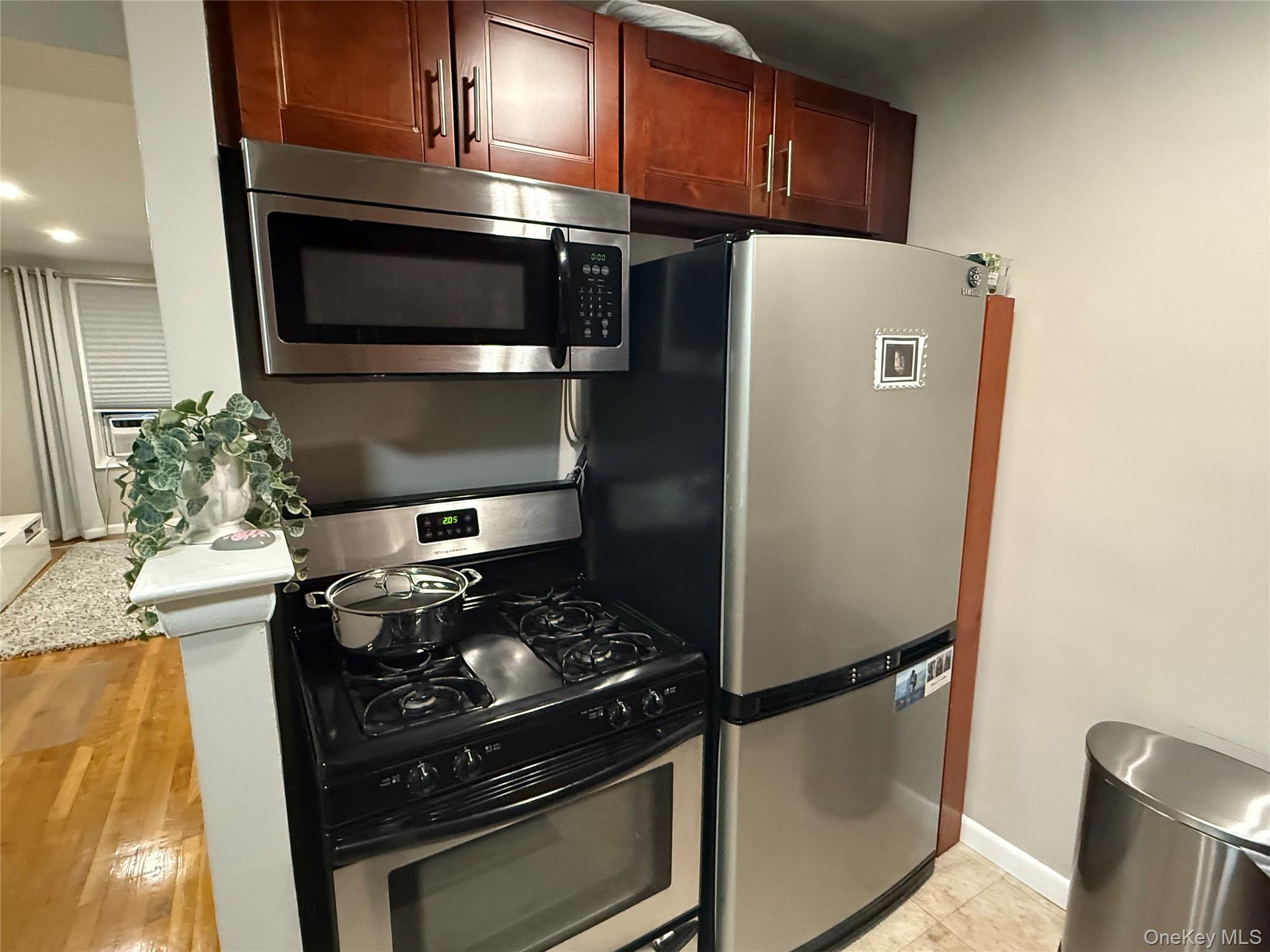 3123 Bailey Avenue, Unit 3A Bronx, NY 10463 - Photo 9 of 17 a kitchen with a stove and a microwave