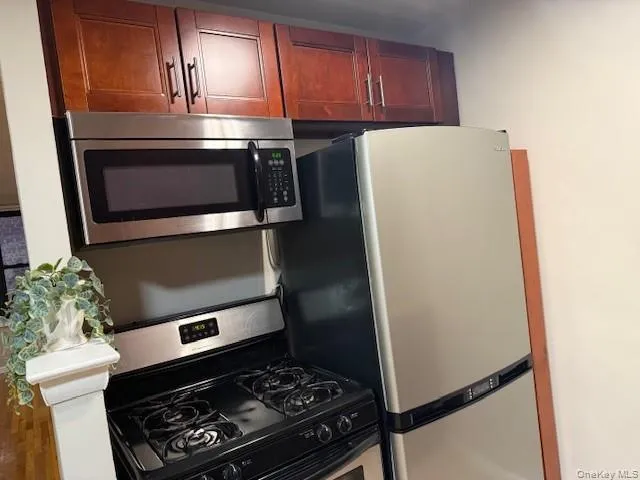 a kitchen with a stove and a microwave
