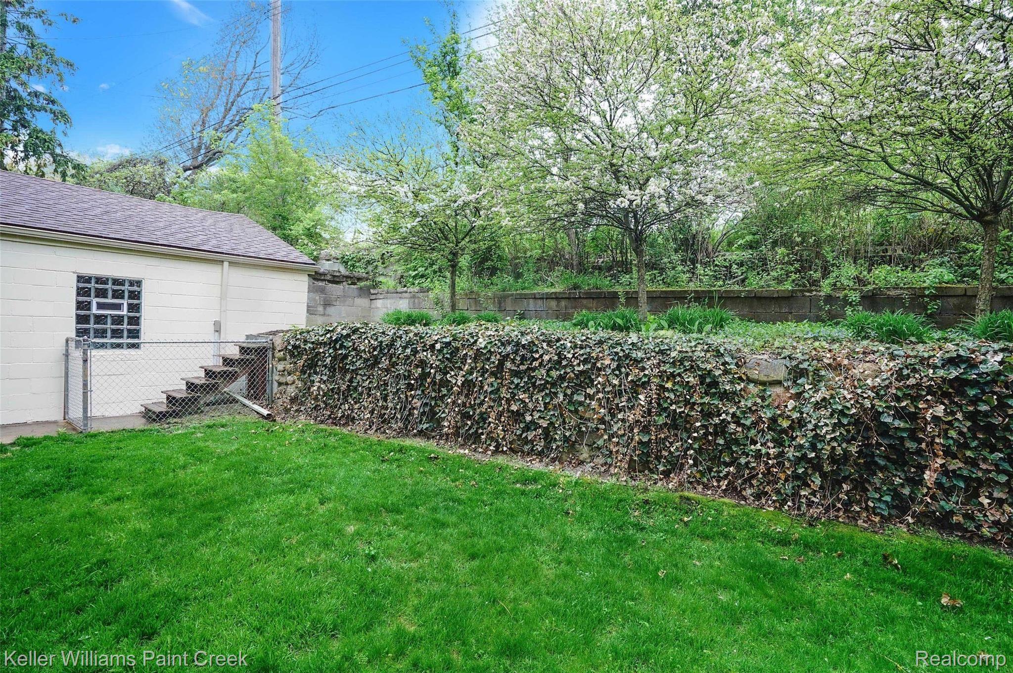 1306 Maple Drive Rochester, MI 48307 - Photo 24 of 26 Rock Retaining Wall with Ivy is Stunning!