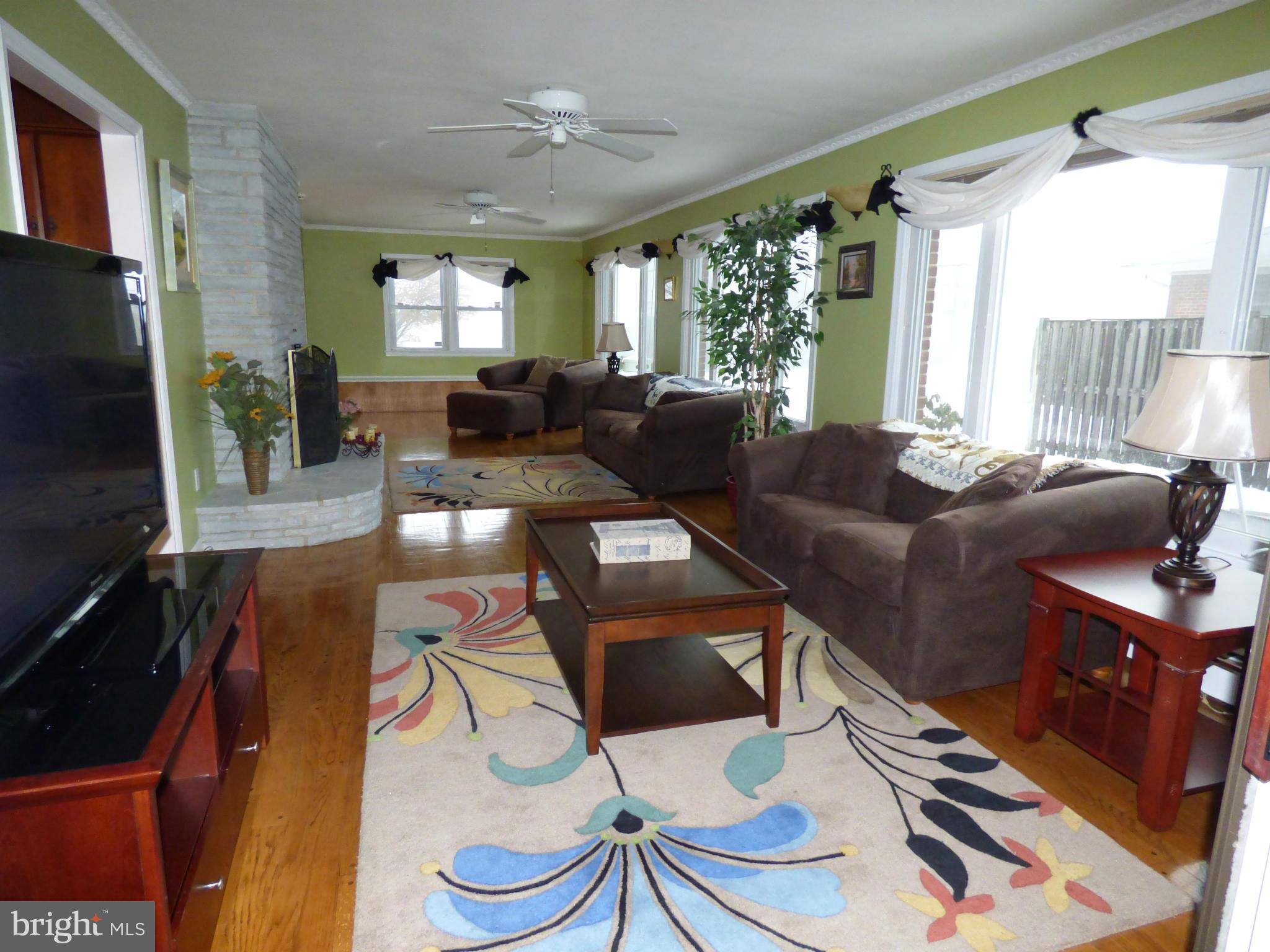 9228 Gue Road Damascus, MD 20872 - Photo 1 of 30 a living room with furniture and a flat screen tv