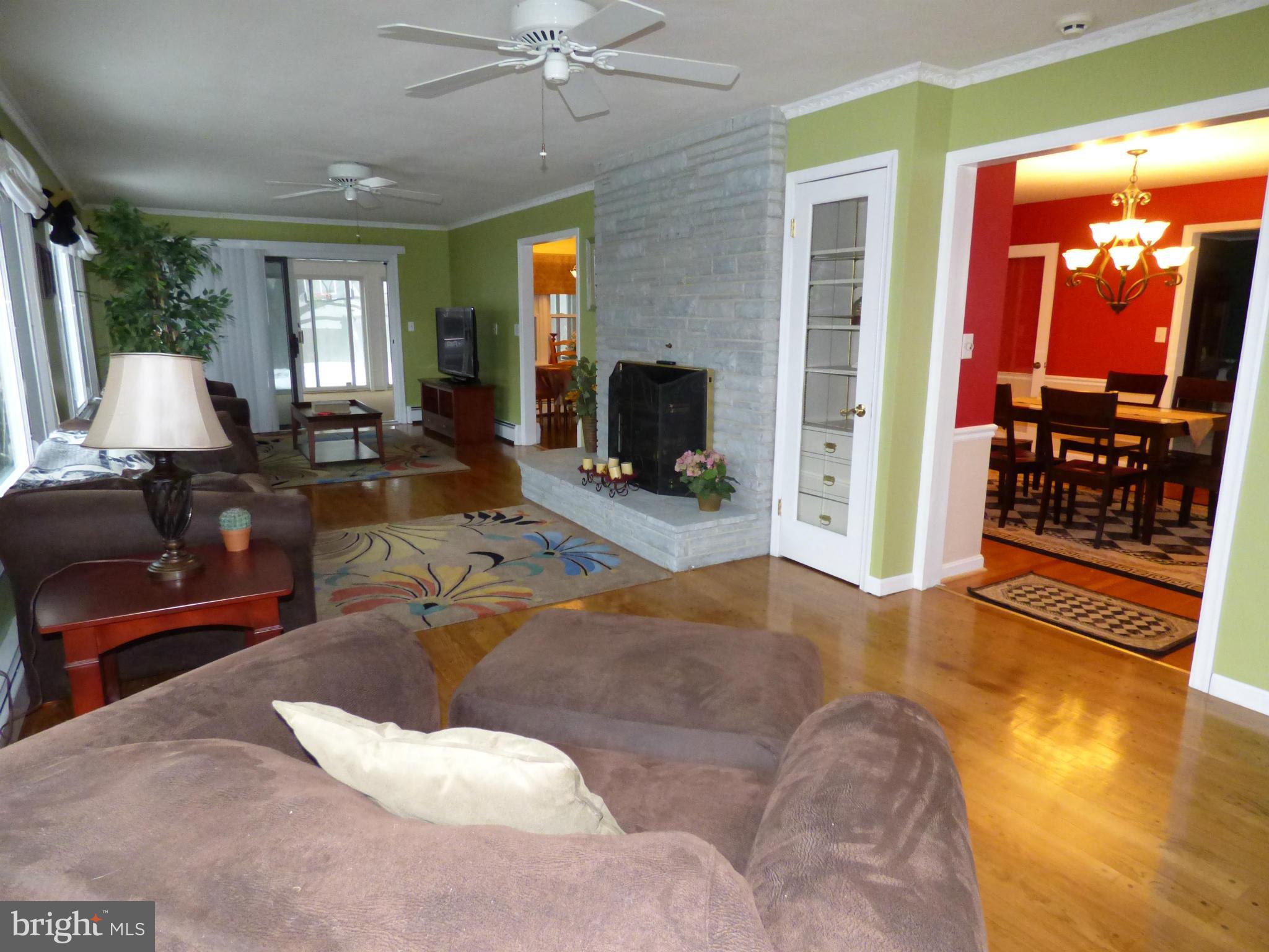 9228 Gue Road Damascus, MD 20872 - Photo 14 of 30 a living room with furniture and a flat screen tv
