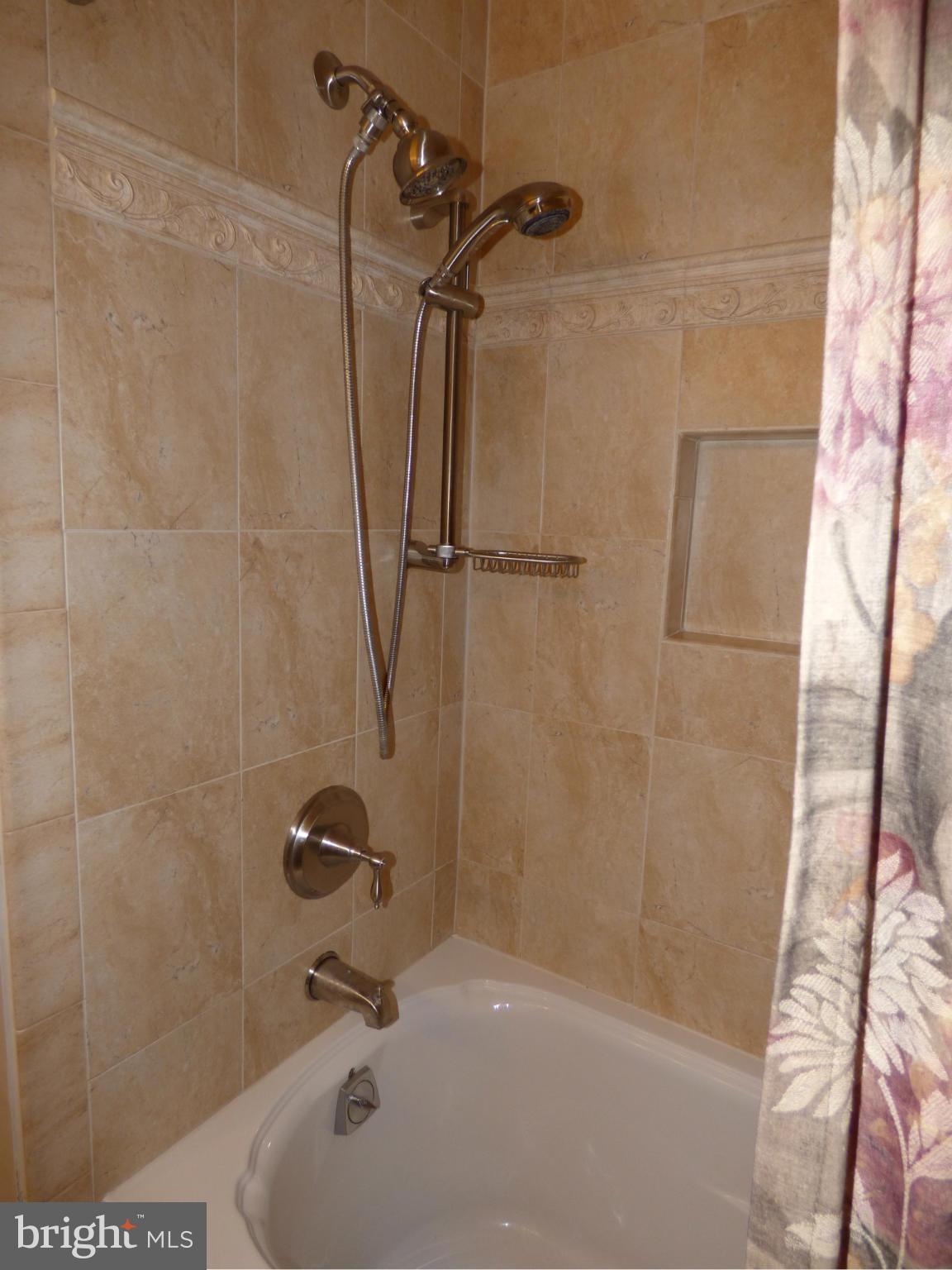 9228 Gue Road Damascus, MD 20872 - Photo 21 of 30 a bathroom with a bath tub