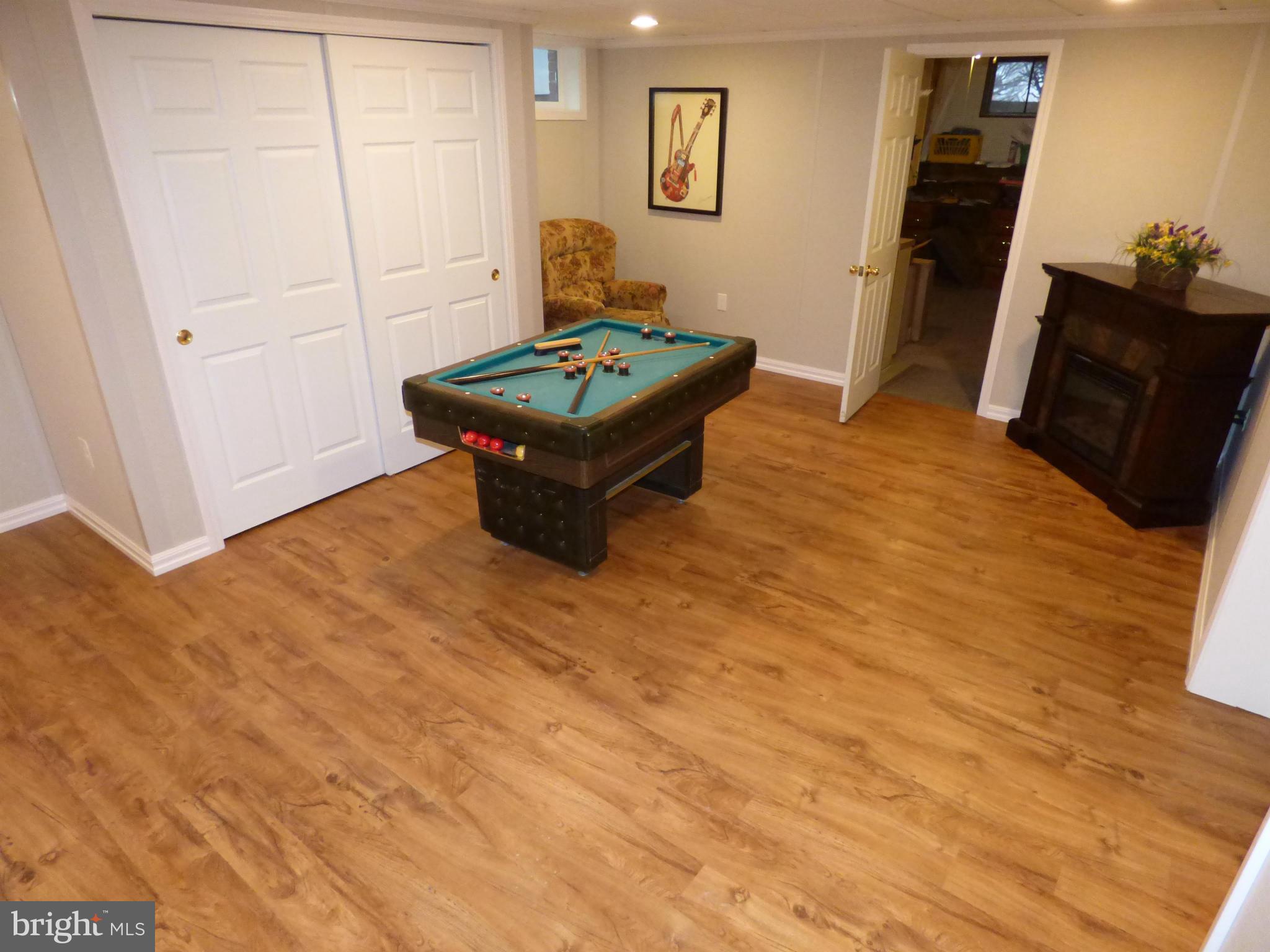9228 Gue Road Damascus, MD 20872 - Photo 22 of 30 a living room with furniture and a flat screen tv