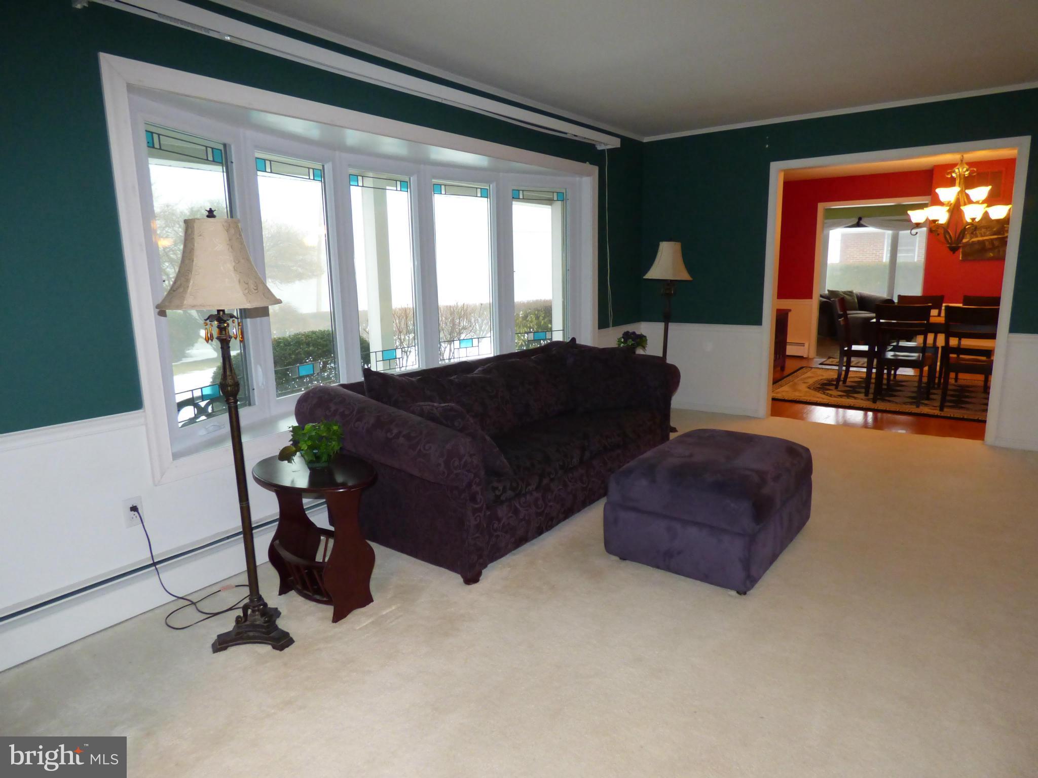 9228 Gue Road Damascus, MD 20872 - Photo 6 of 30 a living room with furniture and a flat screen tv