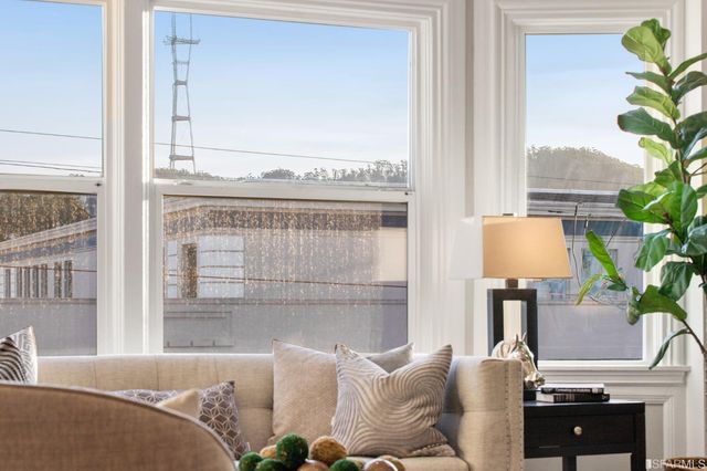 a view of a dining room with furniture wooden floor and a chandelier