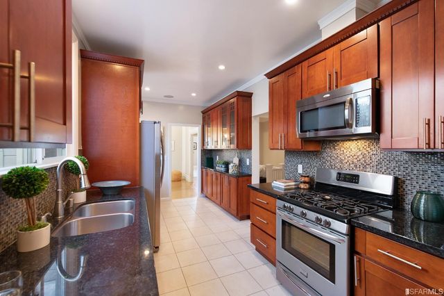 a large bedroom with a bed and large mirror