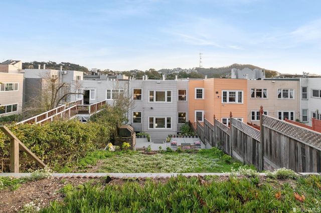 a front view of a livingroom with furniture and a fireplace