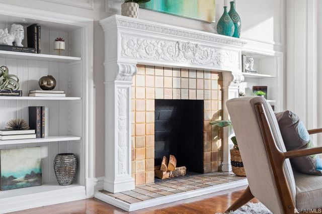 a living room with furniture kitchen view and a table