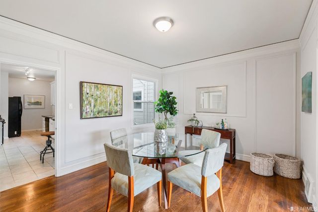 a kitchen with granite countertop a stove top oven microwave and cabinets