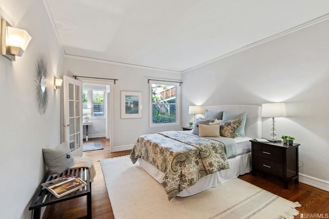 a bedroom with bed and window