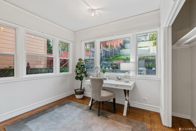 a bathroom with a sink mirror and shower