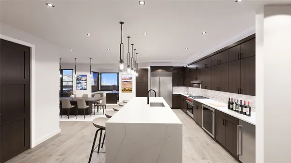 a large kitchen with stainless steel appliances kitchen island granite countertop a refrigerator and a stove top oven