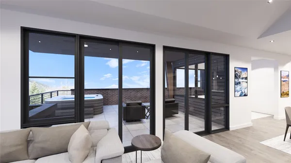 a living room with furniture and a floor to ceiling window