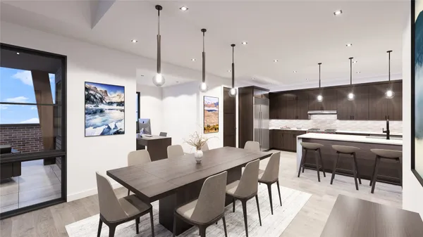 a kitchen with a table chairs refrigerator and microwave
