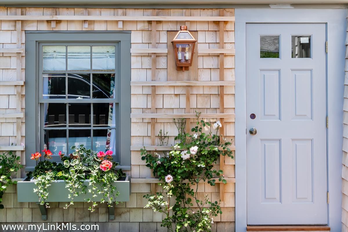 10 Centre Street Nantucket, MA 02554 - Photo 2 of 43 a flower plants in front of a building