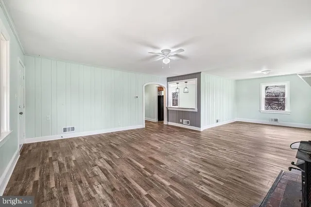 a view of an entryway with wooden floor