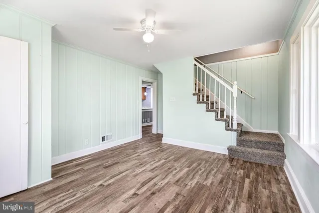 a view of an entryway with wooden floor