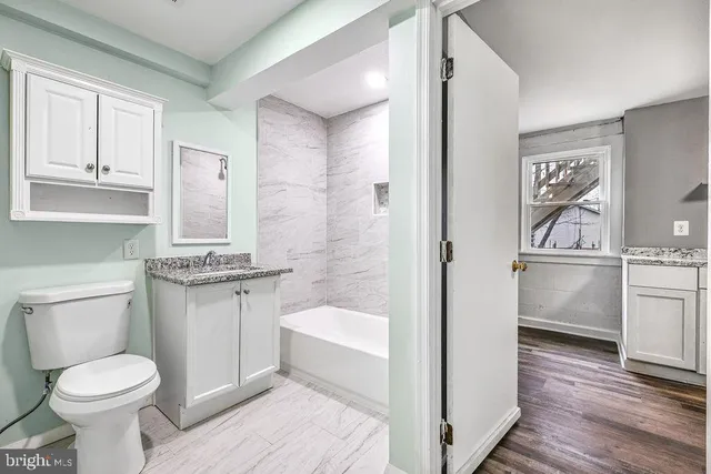 a view of an empty room with a window