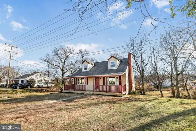 a view of a brick house with a yard next to a yard