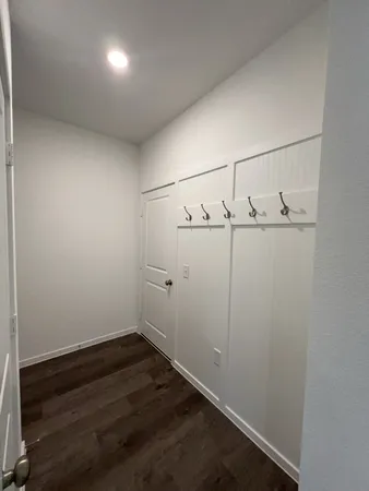 an empty room with racks on the wall