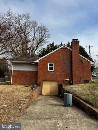 a view of a house with a snow in the yard