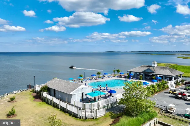 a aerial view of a house with table and chairs