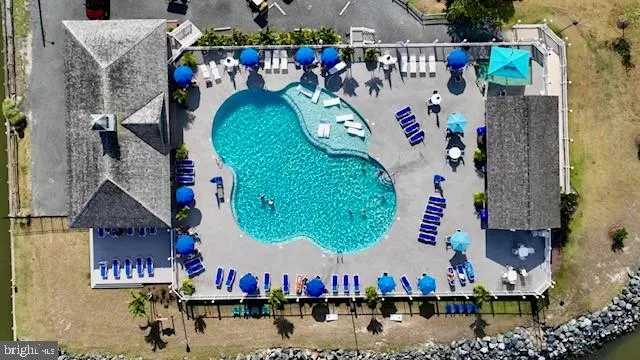 an aerial view of swimming pool outdoor seating