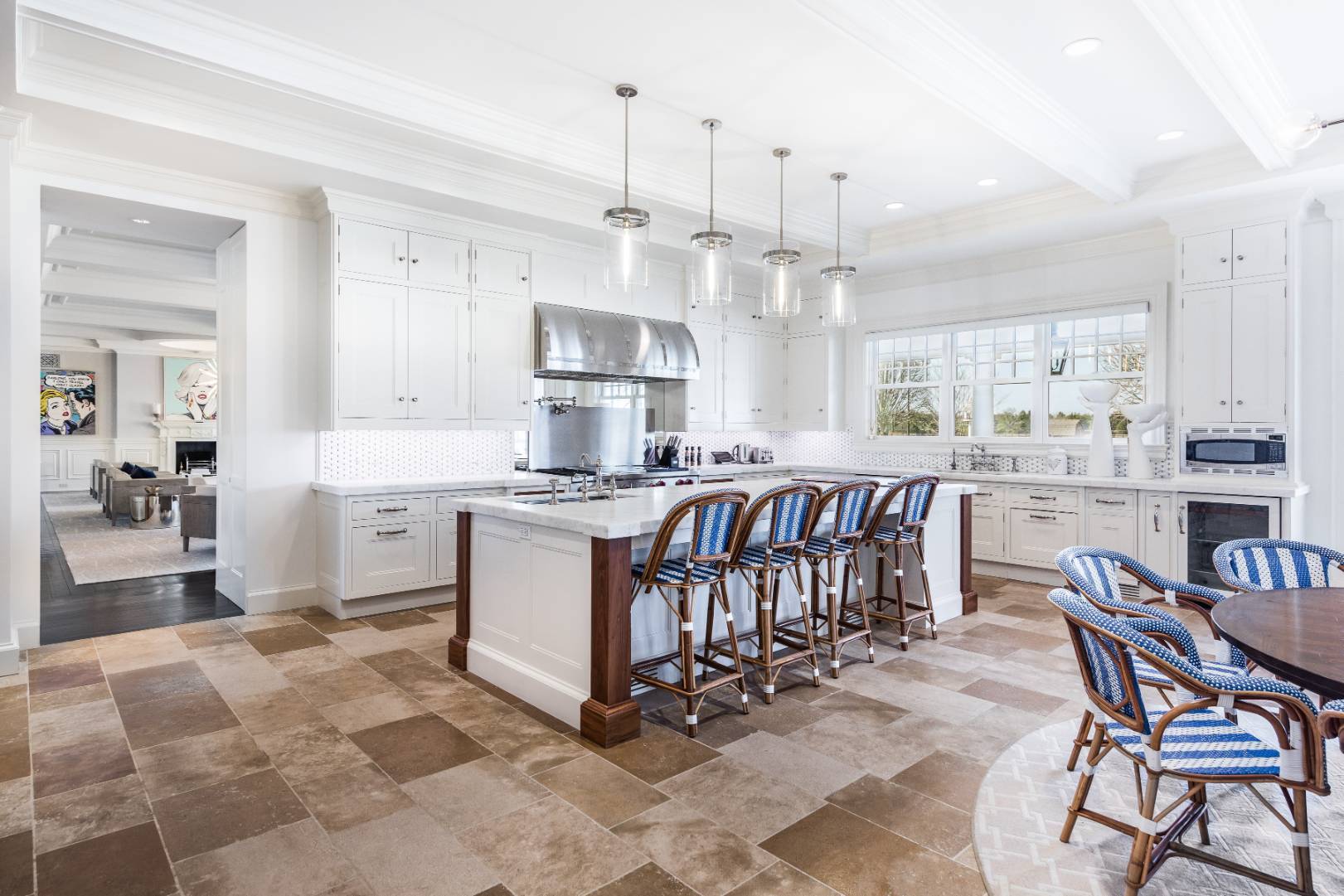 612 Halsey Lane Bridgehampton, NY 11932 - Photo 11 of 31 a kitchen with stainless steel appliances kitchen island granite countertop a sink and cabinets