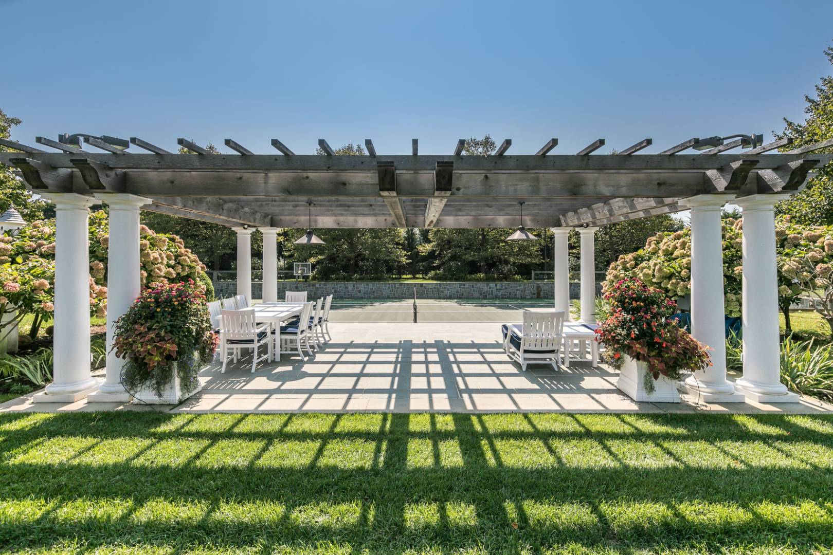 612 Halsey Lane Bridgehampton, NY 11932 - Photo 14 of 31 a view of an chairs and tables in the patio