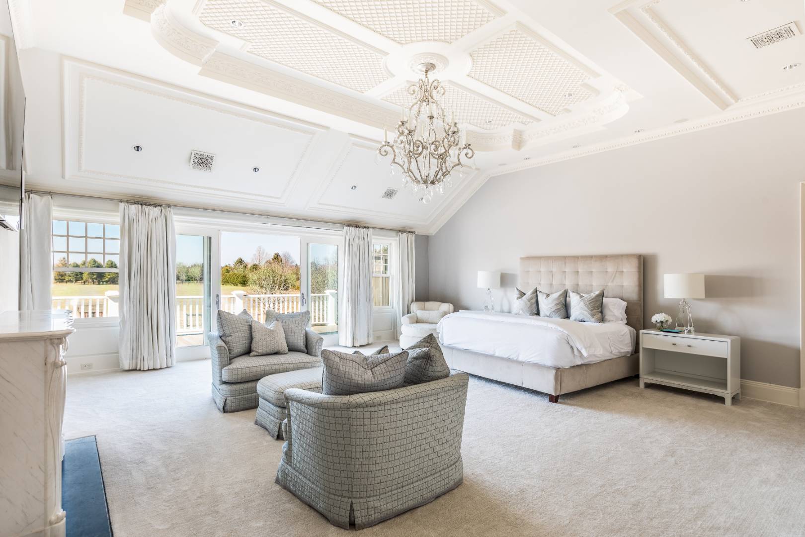 612 Halsey Lane Bridgehampton, NY 11932 - Photo 18 of 31 a living room with furniture and a chandelier