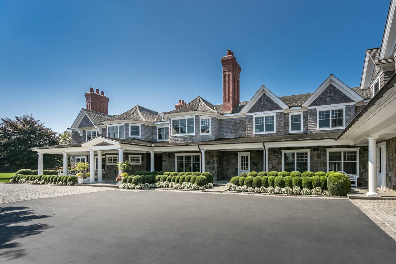 612 Halsey Lane Bridgehampton, NY 11932 - Photo 3 of 31 front view of a house with a yard
