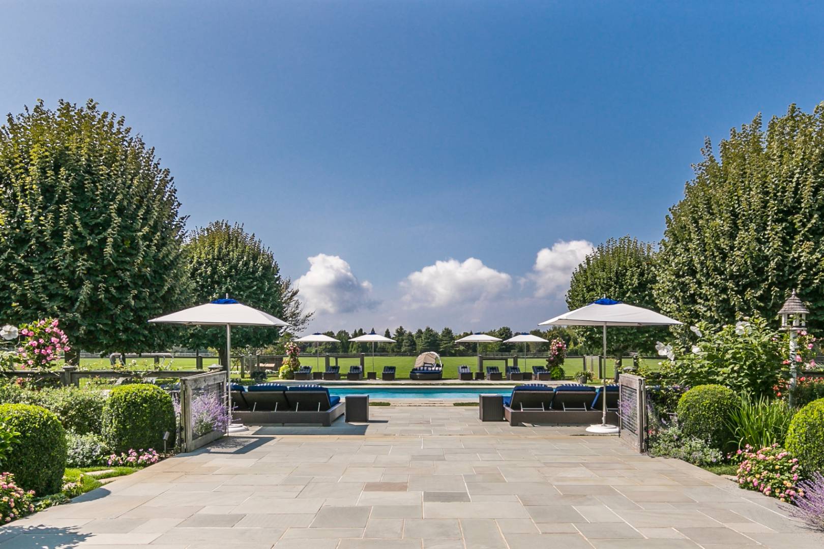 612 Halsey Lane Bridgehampton, NY 11932 - Photo 7 of 31 a view of a bench in front of house