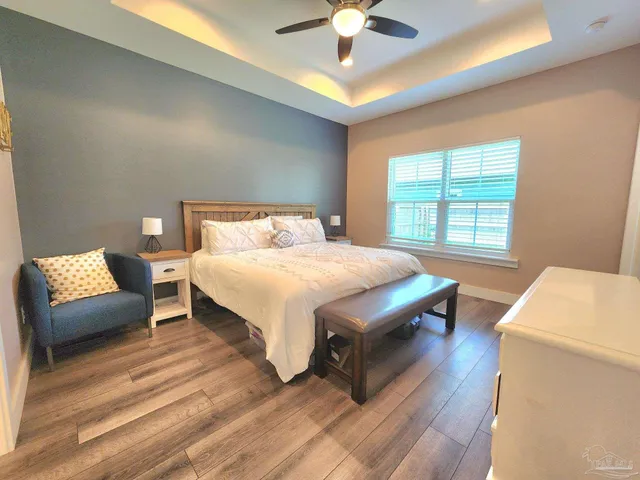 a bedroom with a bed and a couch