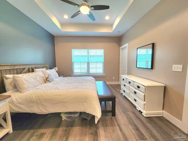 a bedroom with a bed and a dresser