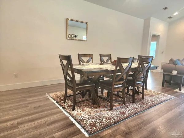 a view of a dining room with furniture
