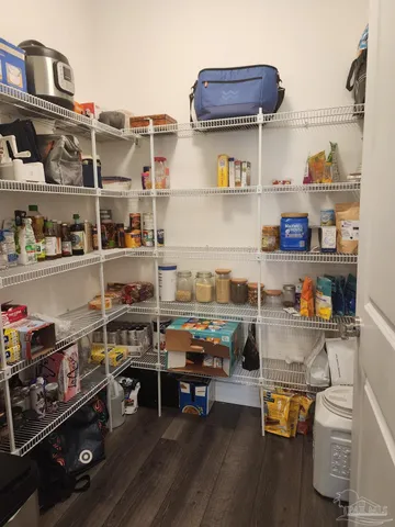 a room with wooden racks and shelf