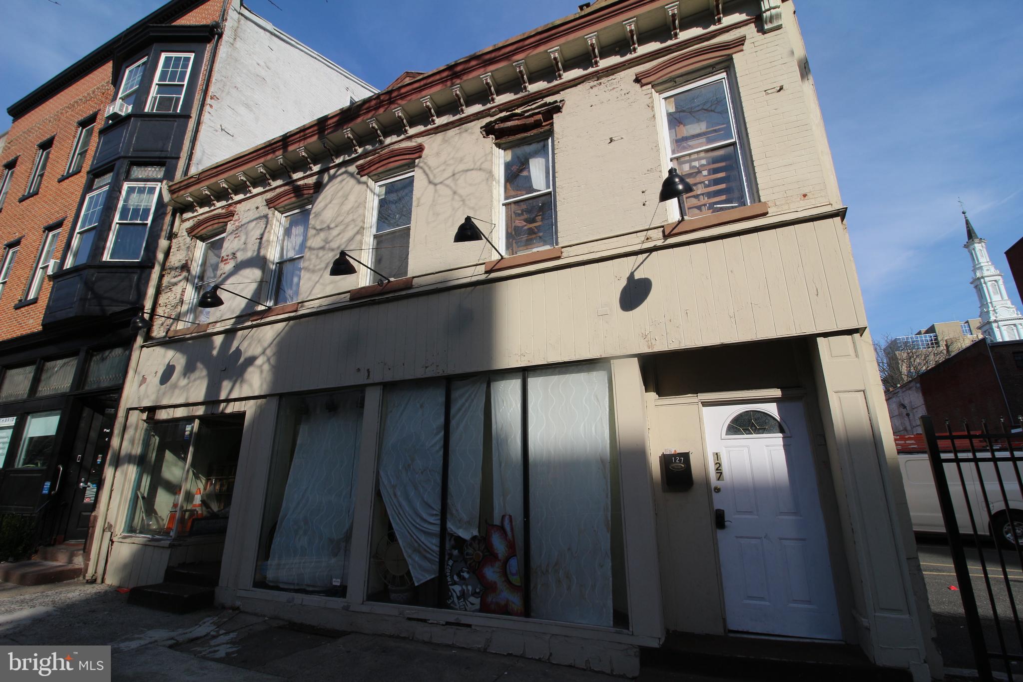 127 North 5th Street Reading, PA 19601 - Photo 4 of 5 a close view of a refrigerator a kitchen and wooden floor