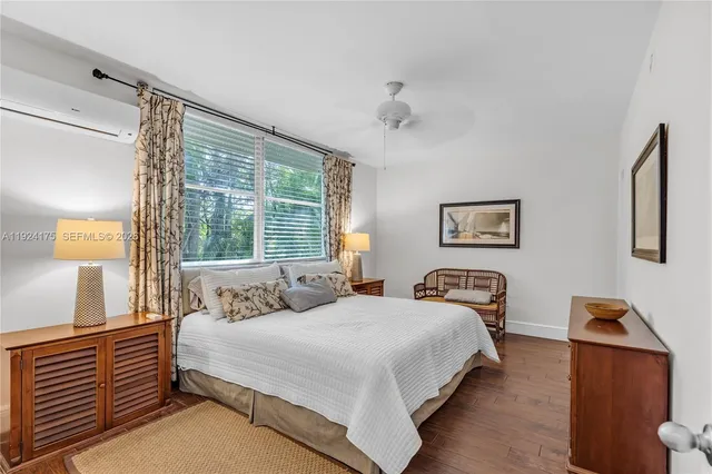 a bedroom with bed and window