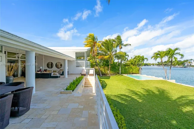 a view of swimming pool with a patio