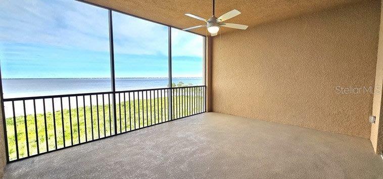89 Vivante Boulevard, Unit 8942 Punta Gorda, FL 33950 - Photo 16 of 44 a view of a hallway with a ceiling fan