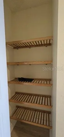 a view of a room with racks on the wall