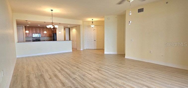 89 Vivante Boulevard, Unit 8942 Punta Gorda, FL 33950 - Photo 22 of 44 a view of a hallway with wooden floor