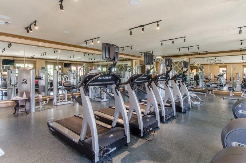 89 Vivante Boulevard, Unit 8942 Punta Gorda, FL 33950 - Photo 25 of 44 a view of a room with gym equipment