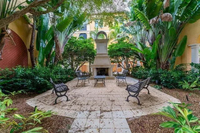 a view of a patio with a table and chairs in a patio