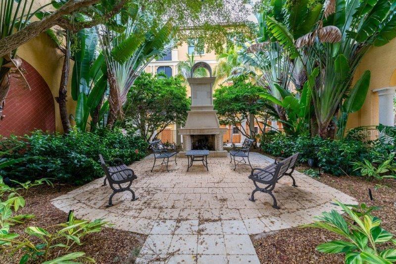 89 Vivante Boulevard, Unit 8942 Punta Gorda, FL 33950 - Photo 28 of 44 a view of a patio with a table and chairs in a patio