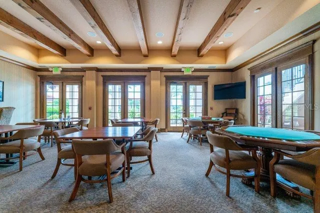 a view of a dining room with furniture window and outside view